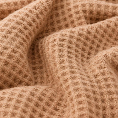 Textura de tricô waffle macia e quentinha